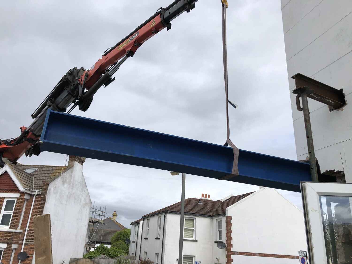 A crane positioning a steel beam