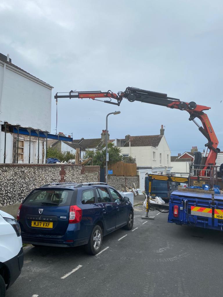 A crane helping to install steel beam